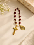 Caroline red bead pocket rosary bracelet with gold-tone crucifix and Marian medal