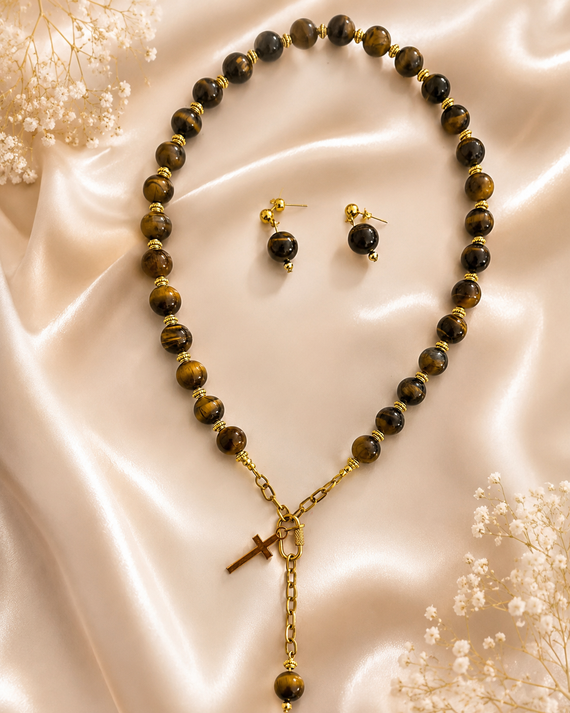 Gabriela tiger eye style cross necklace and earring set on satin