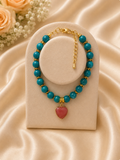Sofia Heart Bracelet on cream display with satin background